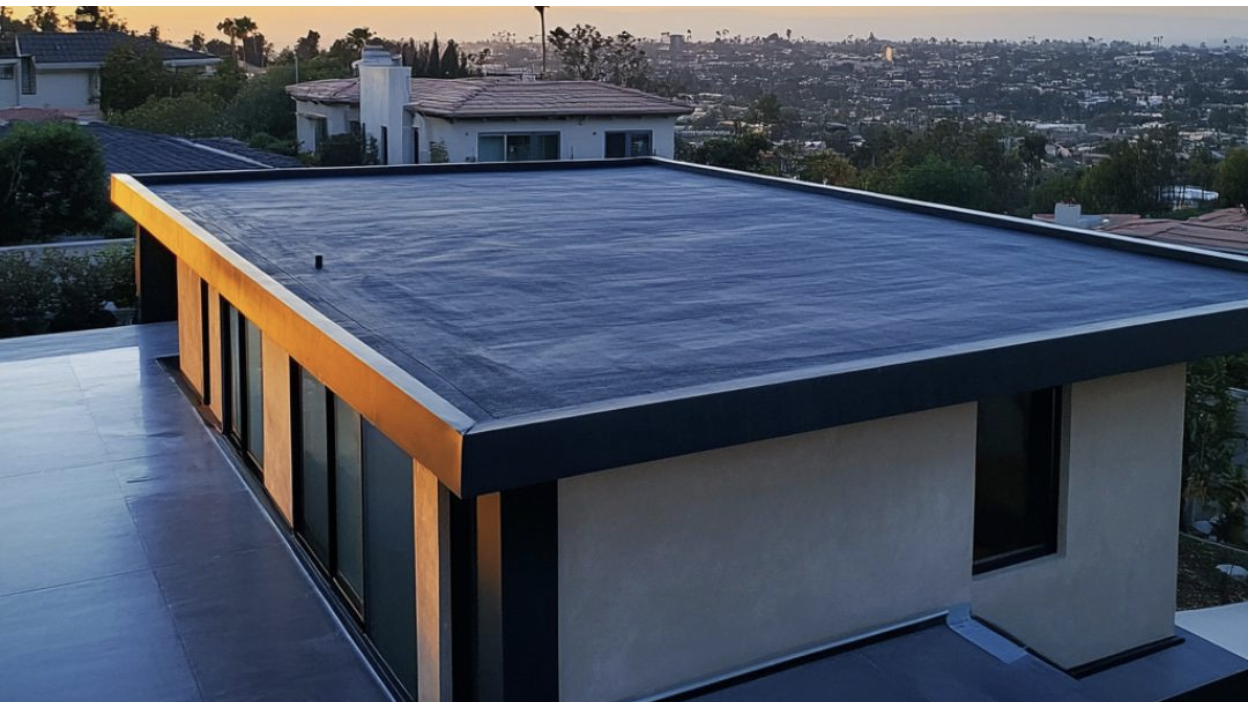 Sunset cast on a building with a flat roof